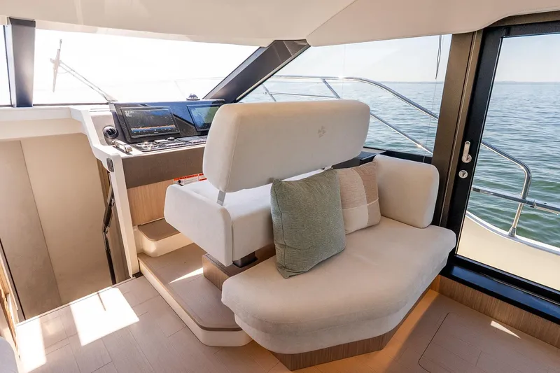 Slide: The Image of Luxurious interior of 2026 Prestige F5.7 yacht with modern helm and seating. - 61