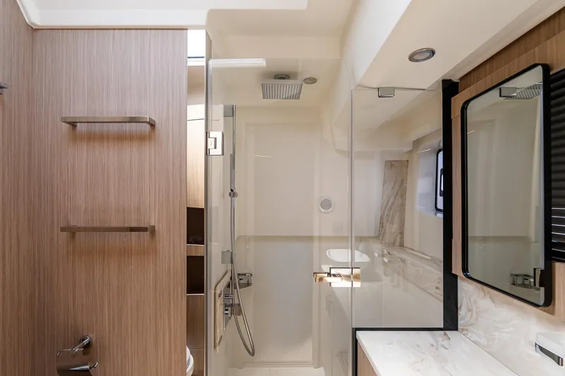Slide: The Image of Luxurious bathroom in 2026 Prestige F5.7 yacht, featuring modern fixtures and elegant wood accents. - 73