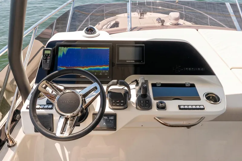 Slide: The Image of Modern helm of 2026 Prestige F5.7 yacht with advanced navigation controls and sleek design. - 25
