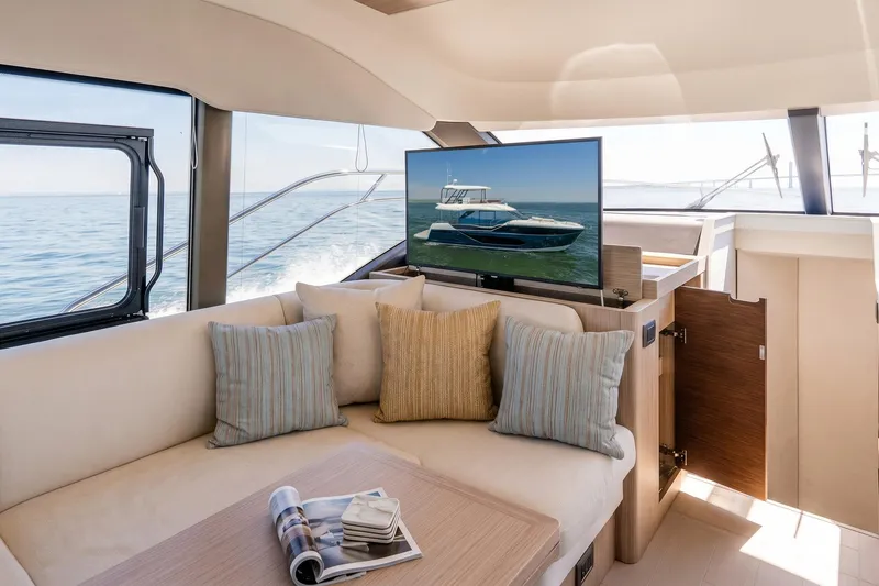 Slide: The Image of Luxurious interior of 2026 Prestige F5.7 yacht with cozy seating and ocean view. - 58