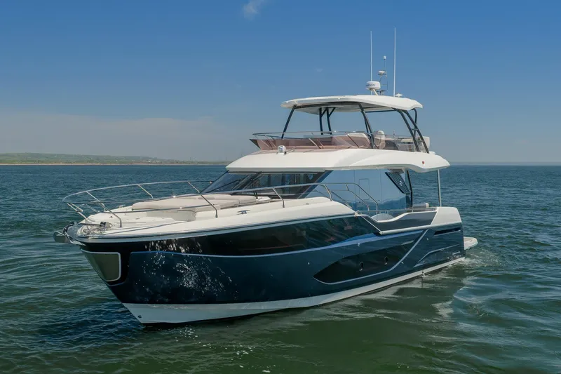 Slide: The Image of Luxury Prestige F5.7 yacht cruising on open water, 2026 model. - 7