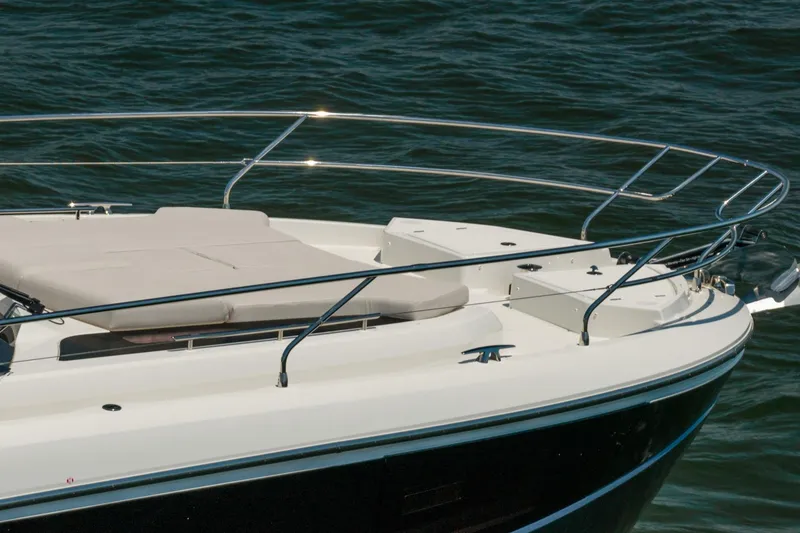 Slide: The Image of Prestige F5.7 yacht bow with sunbed, 2026 model, on calm water. - 13