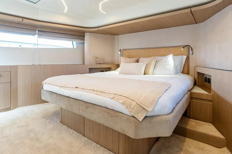 Slide: The Image of Luxurious bedroom interior of 2026 Prestige F5.7 yacht with modern design and cozy bedding. - 66