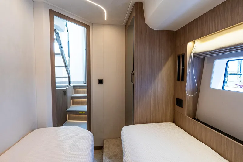 Slide: The Image of Luxurious cabin interior of 2026 Prestige F5.7 yacht with twin beds and modern design. - 81