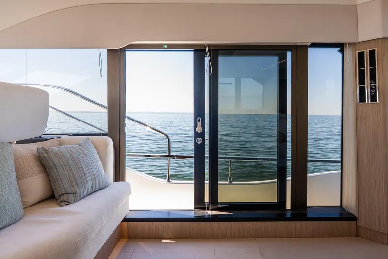 Slide: The Image of Luxurious Prestige F5.7 yacht interior with ocean view through glass doors, 2026 model. - 47