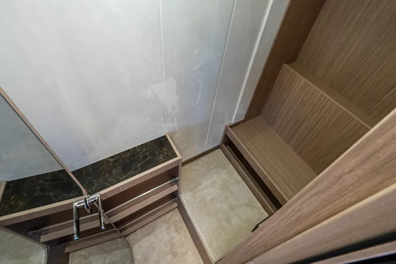 Slide: The Image of Modern interior of Prestige F5.7 yacht, featuring sleek wood finishes and elegant design, 2026 model. - 77