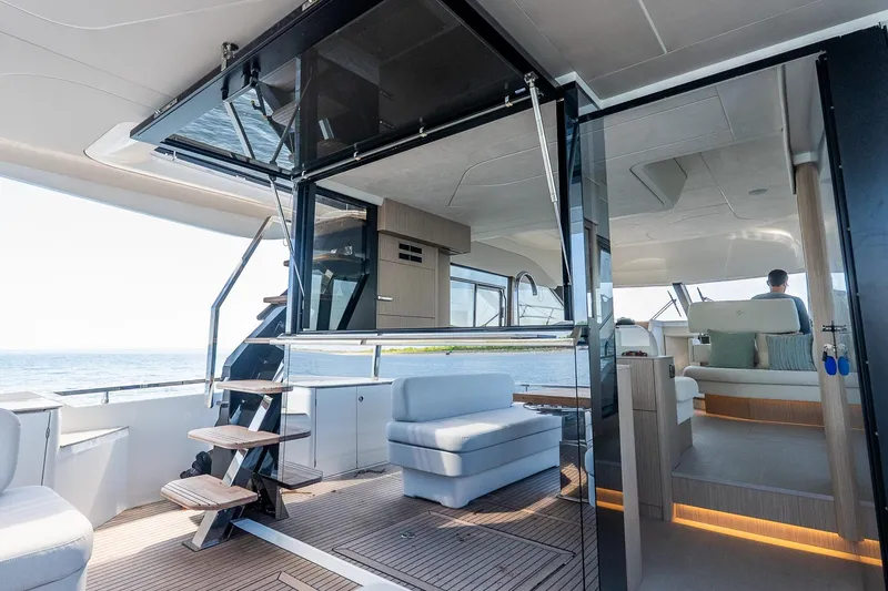 Slide: The Image of Luxurious interior of 2026 Prestige F5.7 yacht with modern seating and ocean view. - 46