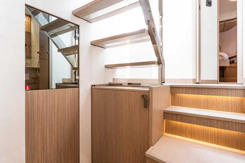 Slide: The Image of Modern staircase with wooden steps and ambient lighting in Prestige F5.7 yacht, 2026 model. - 64