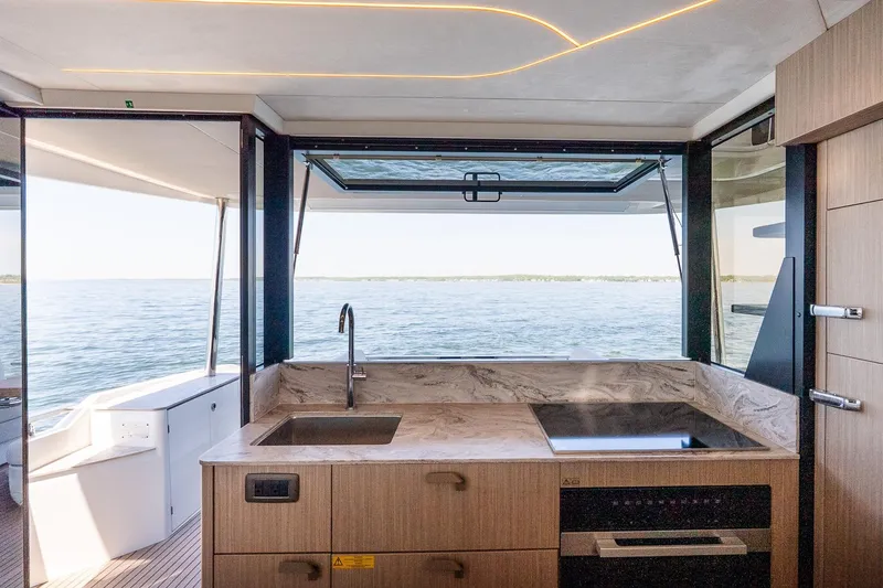 Slide: The Image of Modern kitchen on Prestige F5.7 yacht, 2026 model, with ocean view. - 49