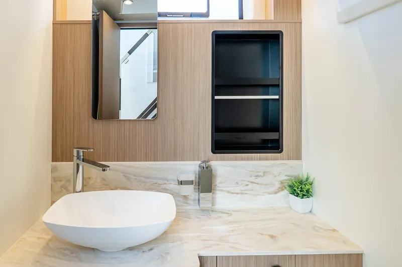 Slide: The Image of Modern bathroom vanity with vessel sink, marble countertop, and wooden cabinetry in Prestige F5.7, 2026. - 75