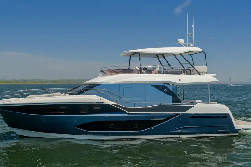 Slide: The Image of Luxury Prestige F5.7 yacht cruising on open water, 2026 model. - 6