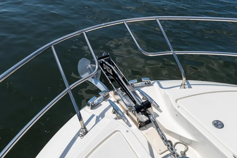 Slide: The Image of Bow of Prestige F5.7 boat with anchor, 2026 model, on calm water. - 18