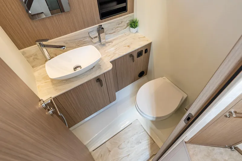 Slide: The Image of Modern bathroom in 2026 Prestige F5.7 yacht with sleek sink and toilet. - 74