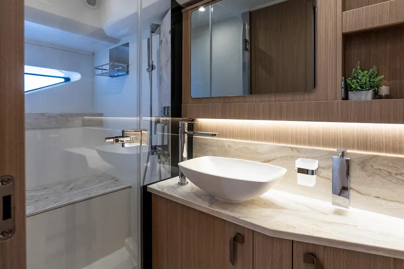 Slide: The Image of Luxurious bathroom in 2026 Prestige F5.7 yacht with modern fixtures and elegant design. - 79