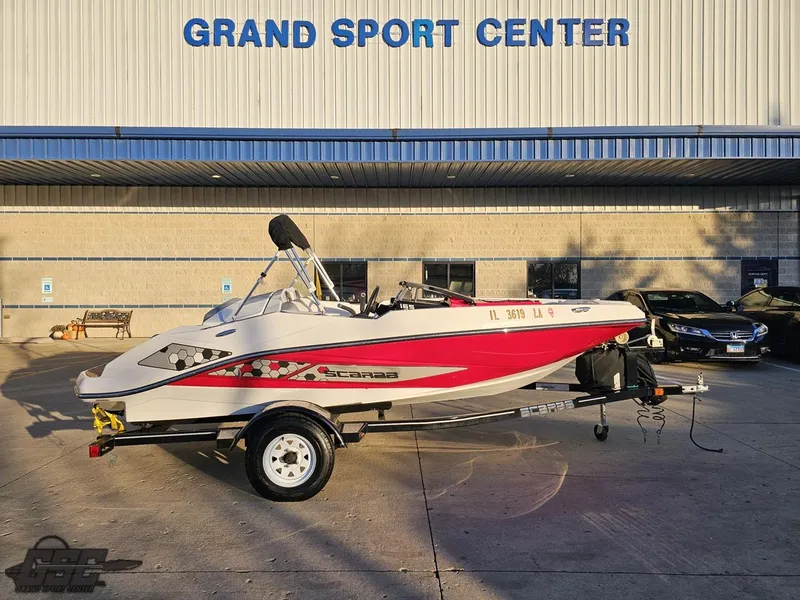 Slide: The Image of 2018 Scarab 165 ID boat at Grand Sport Center, parked on a trailer. - 1