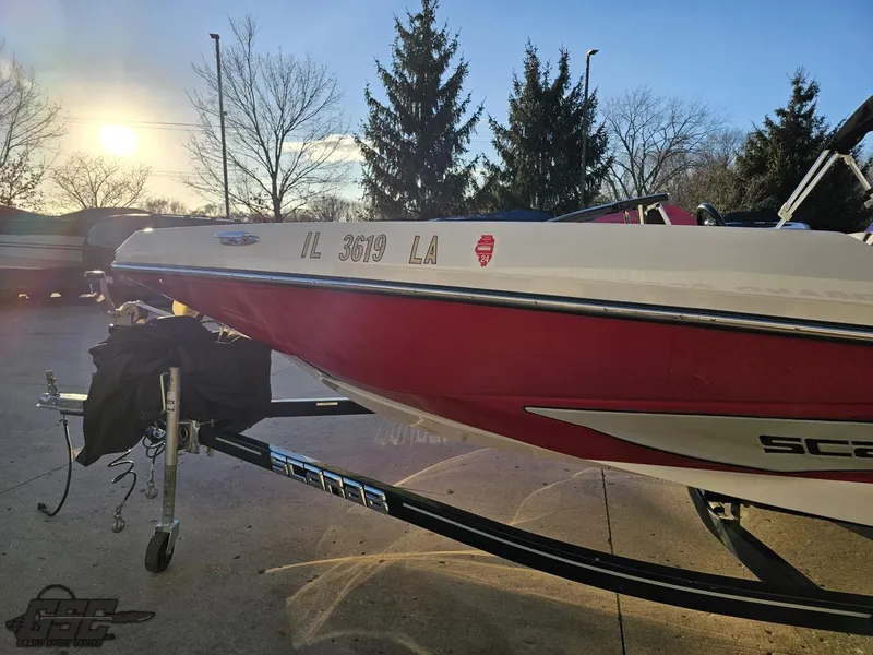 Slide: The Image of 2018 Scarab 165 ID boat on trailer at sunset. - 15