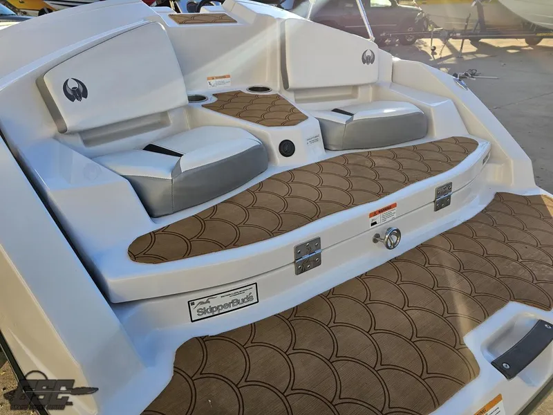Slide: The Image of 2018 Scarab 165 ID boat interior with brown patterned flooring and seating. - 24