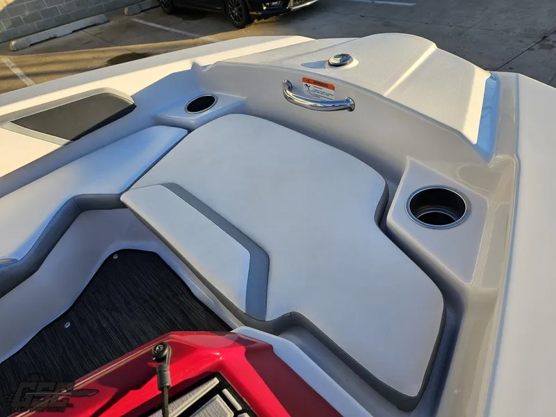 Slide: The Image of 2018 Scarab 165 ID boat interior with cup holders and seating area. - 30