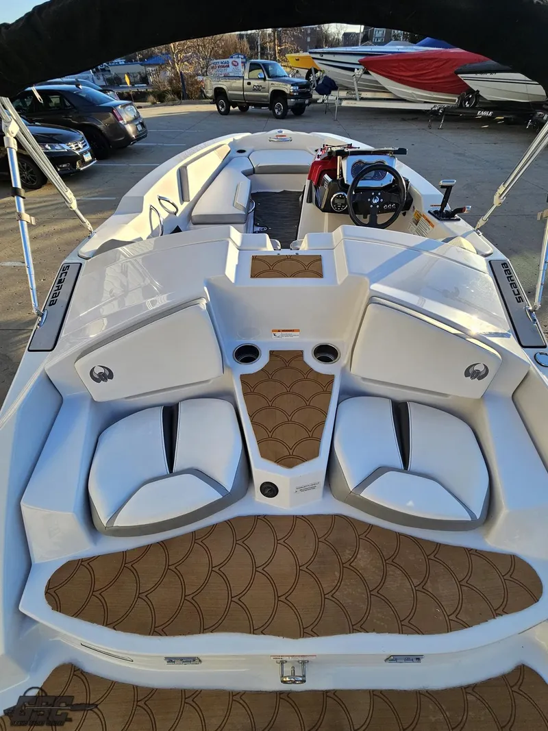 Slide: The Image of 2018 Scarab 165 ID boat interior with modern seating and steering wheel. - 39