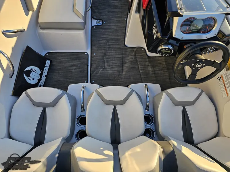 Slide: The Image of 2018 Scarab 165 ID boat interior with seating and steering wheel. - 43