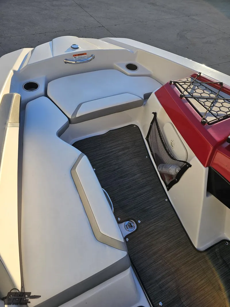 Slide: The Image of 2018 Scarab 165 ID boat interior with seating and storage features. - 45