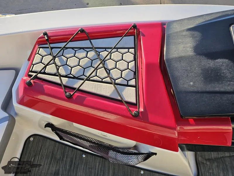 Slide: The Image of 2018 Scarab 165 ID boat interior with red accents and hexagonal design. - 46