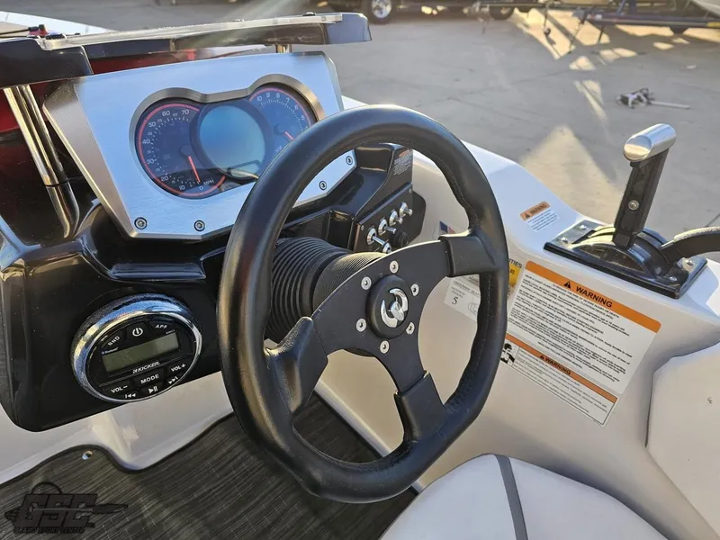Slide: The Image of 2018 Scarab 165 ID boat dashboard with steering wheel and control panel. - 48