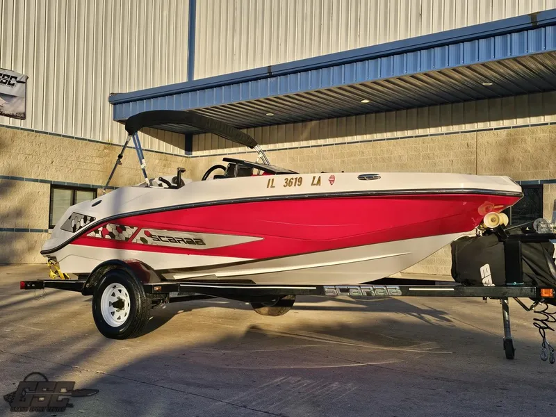 Slide: The Image of 2018 Scarab 165 ID boat with red and white design on a trailer. - 5