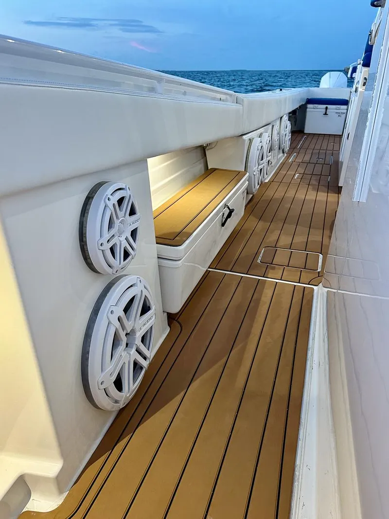 Slide: The Image of 2018 Hydra-Sports 5300 Suenos boat deck with speakers and seating, ocean view. - 11