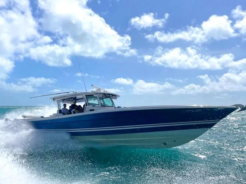 Slide: The Image of 2018 Hydra-Sports 5300 Suenos boat cruising on clear blue ocean under sunny skies. - 13