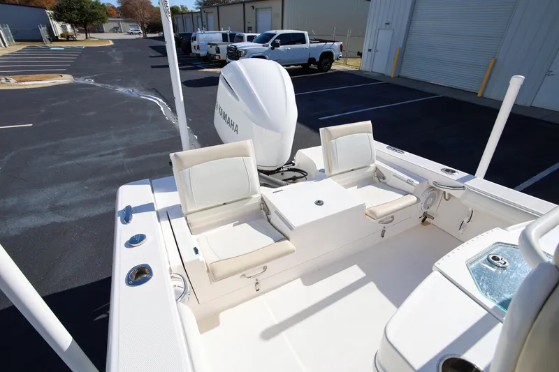 Slide: The Image of 2017 Everglades 253 Center Console boat interior with seating and Yamaha engine. - 11