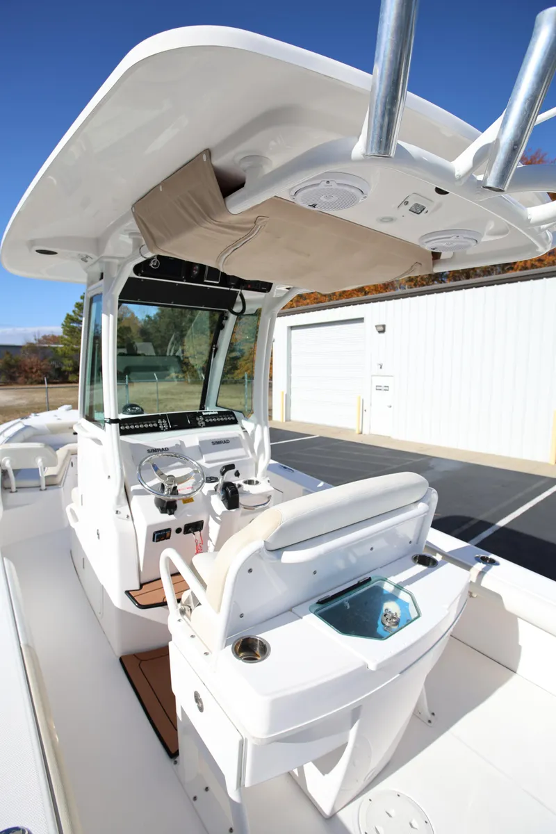 Slide: The Image of 2017 Everglades 253 Center Console boat with modern helm and seating. - 14