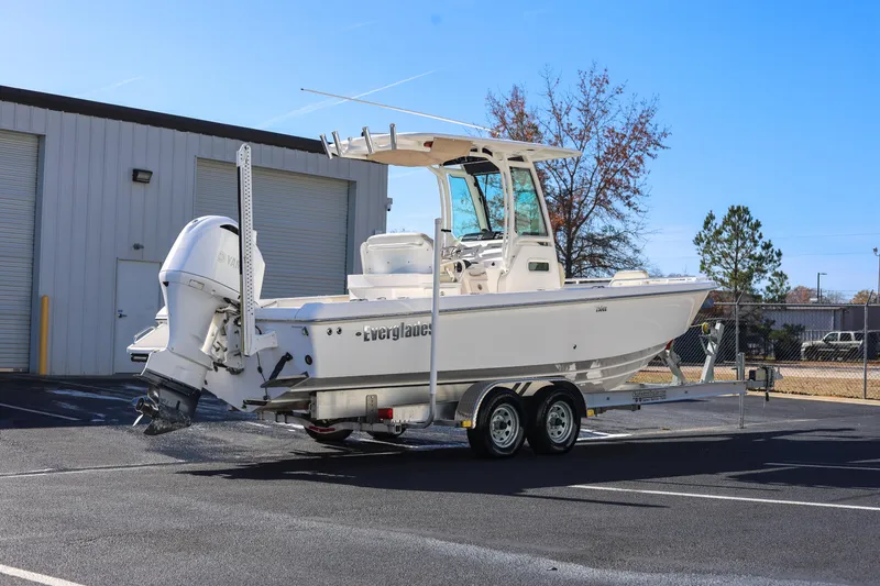 Slide: The Image of 2017 Everglades 253 Center Console boat on trailer in parking lot. - 2
