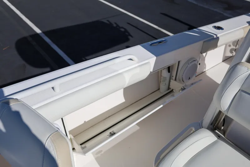 Slide: The Image of 2017 Everglades 253 Center Console boat interior with storage compartment and seating. - 23