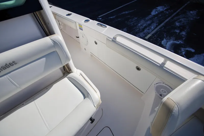 Slide: The Image of Interior view of 2017 Everglades 253 Center Console boat with white seating. - 24
