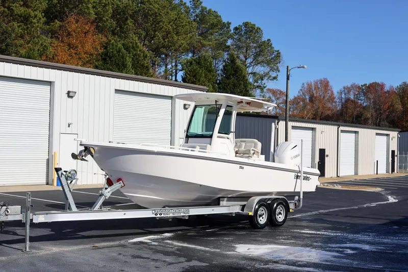 Slide: The Image of 2017 Everglades 253 Center Console boat on trailer near storage units. - 3