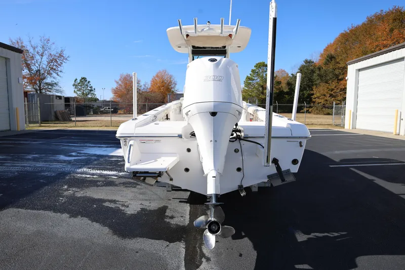 Slide: The Image of 2017 Everglades 253 Center Console boat, rear view, parked outdoors. - 5