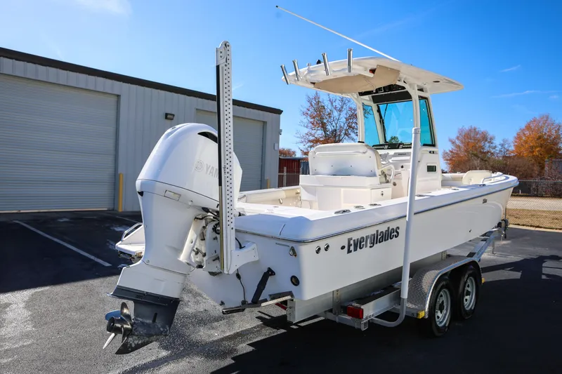 Slide: The Image of 2017 Everglades 253 Center Console boat on trailer, parked outdoors. - 6