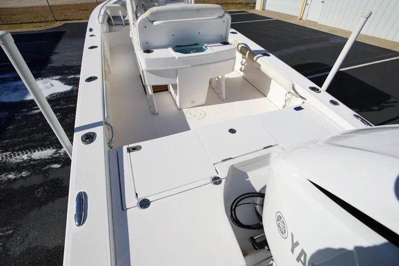 Slide: The Image of 2017 Everglades 253 Center Console boat interior with Yamaha engine, docked outdoors. - 9
