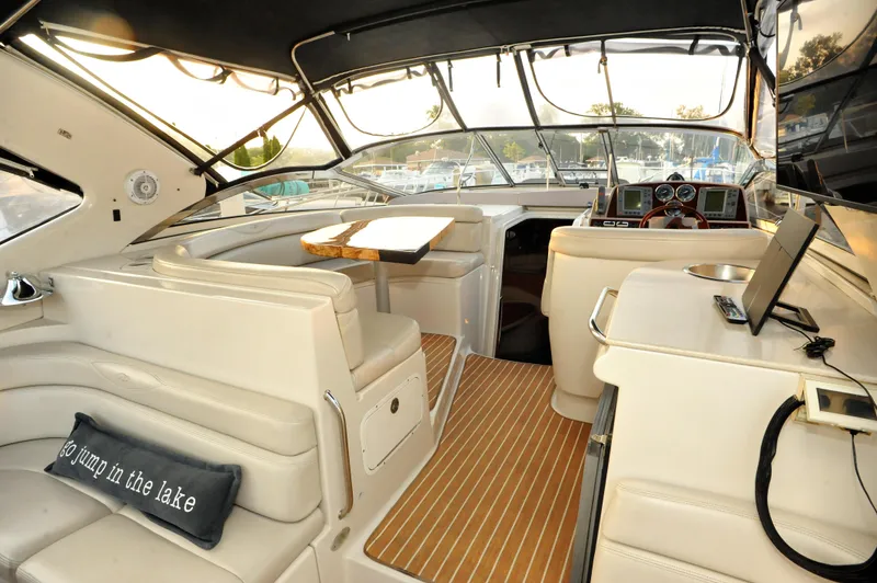Slide: The Image of Interior of 2001 Regal Commodore 4160 yacht with plush seating and modern dashboard. - 11