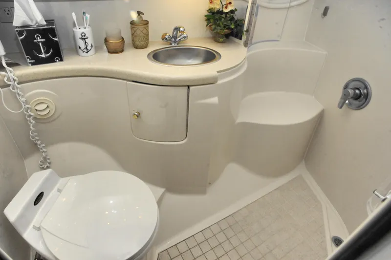 Slide: The Image of Compact bathroom in 2001 Regal Commodore 4160 yacht with sink, toilet, and shower. - 17