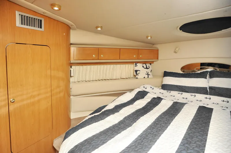 Slide: The Image of Luxurious cabin interior of 2001 Regal Commodore 4160 yacht with striped bedding. - 18