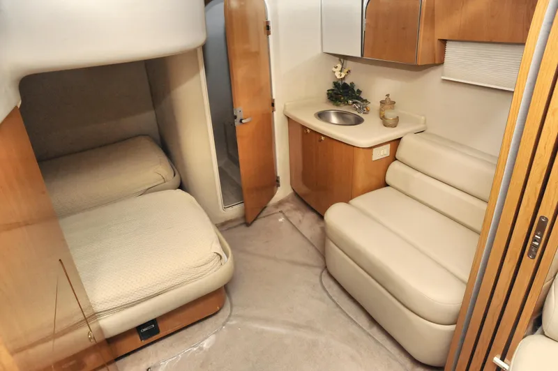 Slide: The Image of Interior of 2001 Regal Commodore 4160 yacht with cozy cabin and seating area. - 21