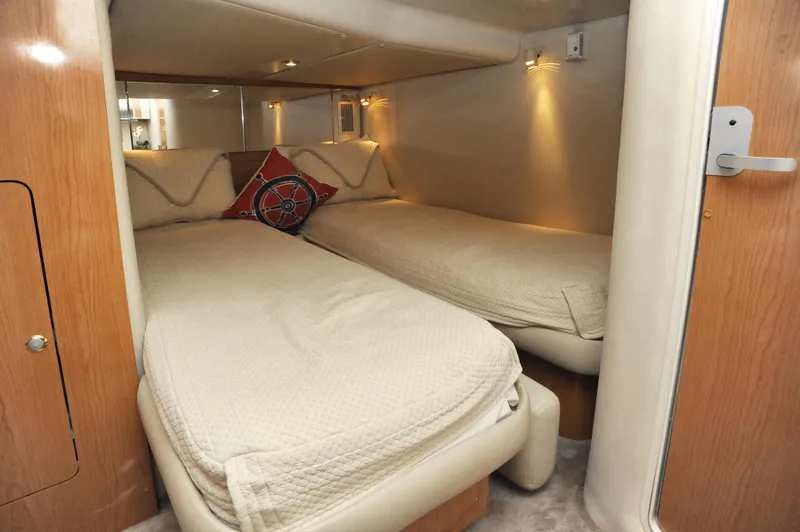 Slide: The Image of 2001 Regal Commodore 4160 cabin with twin beds and cozy lighting. - 22