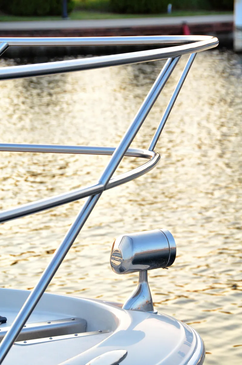Slide: The Image of Close-up of 2001 Regal Commodore 4160 yacht railing by the water. - 3