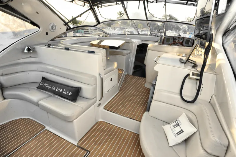 Slide: The Image of Interior of 2001 Regal Commodore 4160 yacht with beige seating and wood flooring. - 30