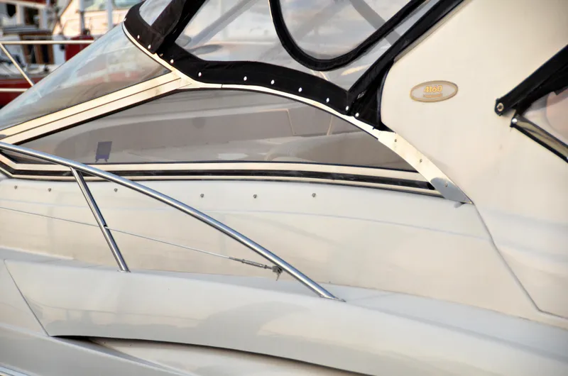 Slide: The Image of Close-up of 2001 Regal Commodore 4160 yacht exterior with sleek design and chrome details. - 5