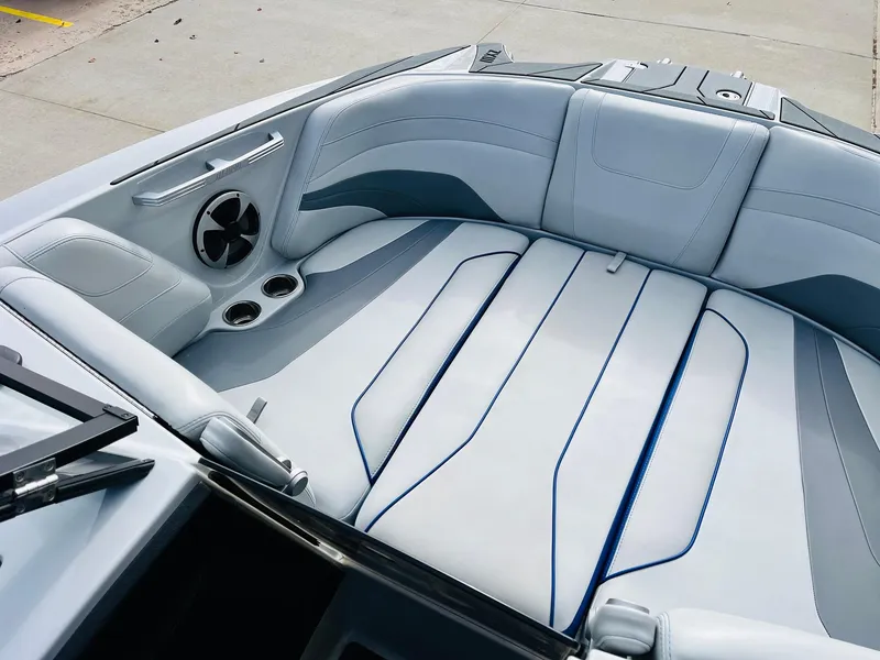 Slide: The Image of 2020 Malibu Wakesetter 24 MXZ boat interior with sleek seating and modern design. - 11