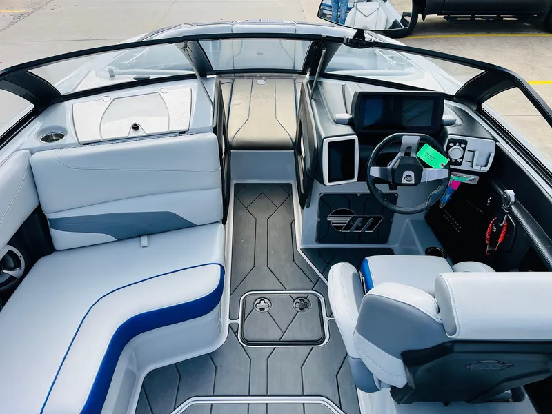 Slide: The Image of 2020 Malibu Wakesetter 24 MXZ boat interior with modern dashboard and seating. - 16