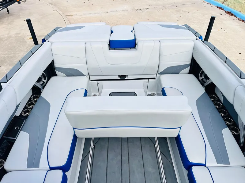 Slide: The Image of 2020 Malibu Wakesetter 24 MXZ interior with white and blue seating. - 30